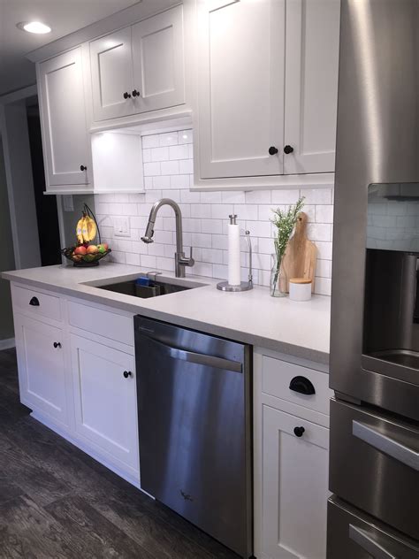 galley kitchen with white cabinets with stainless steel appliances|modern white galley kitchen.